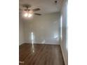 Well lit bedroom featuring ceiling fan, wood look floors, and double hung window at 805 Da Vinci St, Durham, NC 27704