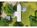 Aerial view of home with deck, pool, outbuildings, and verdant surrounding landscape at 8089 Crawford Currin Rd, Oxford, NC 27565