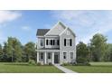 Traditional two-story home with gray siding, black shutters, and a welcoming front porch at 901 Crossbill Dr, Knightdale, NC 27545
