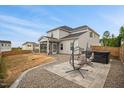 Spacious backyard featuring a screened-in porch, patio with seating, and a fenced yard at 95 Buckthorn Dr, Youngsville, NC 27596