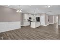 Bright open-concept kitchen with granite countertops, stainless steel appliances, and hardwood floors at 1085 Lobdale Ct, Burlington, NC 27215