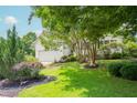 Charming home with a beautifully landscaped yard, mature trees and an attached two-car garage at 1113 Pilton Pl, Raleigh, NC 27604
