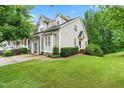 Lovely home with lush green lawn, tidy landscaping, and a well-maintained exterior at 112 River Dell Townes Ave, Clayton, NC 27527
