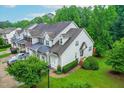 An eye-level aerial view of a well-maintained home with manicured landscaping at 112 River Dell Townes Ave, Clayton, NC 27527