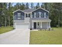 Charming two-story home featuring classic American architecture and a well-maintained lawn at 124 Teagarden Ct, Sanford, NC 27332