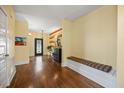 Inviting foyer with hardwood floors, decorative lighting, and an accent wall at 12636 Old Creedmoor Rd, Raleigh, NC 27613
