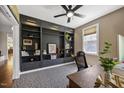 Office space with custom built-in bookshelves and a large window for natural light at 12636 Old Creedmoor Rd, Raleigh, NC 27613