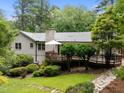 Expansive deck and lush backyard ideal for outdoor living and entertaining at 1706 Rangecrest Rd, Raleigh, NC 27612