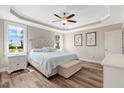 Comfortable main bedroom with tray ceiling, fan, and ensuite bathroom at 1779 Walter Grissom Rd, Kittrell, NC 27544