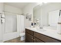 Clean bathroom with a shower-tub combo, a neutral color scheme, and a vanity with a white countertop at 225 Rosewood Ln, Youngsville, NC 27596