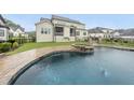An eye-level view of the backyard pool, deck and fenced-in yard, perfect for outdoor entertainment at 329 Broad Elm Ln, Apex, NC 27523