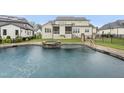 An inviting backyard pool and spa featuring a stone surround, ideal for relaxation and entertainment at 329 Broad Elm Ln, Apex, NC 27523
