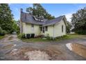 Charming two-story house featuring classic design, gabled roof and spacious backyard area at 421 E Morehead St, Burlington, NC 27215