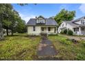 A charming two-story house with a traditional architectural design and quaint front porch at 421 E Morehead St, Burlington, NC 27215