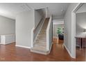 A carpeted stairway leading to the upper floor, connecting the home's levels at 612 Quartz Dr, Durham, NC 27703