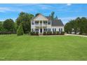 Charming two-story home with a beautifully maintained lawn and traditional architectural details at 750 Raymond Dr, Clayton, NC 27527