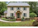Charming two-story home with a well-manicured front yard at 7520 Milestone Ct, Raleigh, NC 27615
