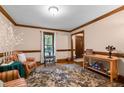 Comfortable living room featuring hardwood floors, an area rug, and neutral walls at 7520 Milestone Ct, Raleigh, NC 27615