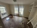 Spacious room with large windows, hardwood floors, and built in shelving providing a bright and airy atmosphere at 0 Chapel Hill Rd, Durham, NC 27707