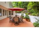 Inviting patio with a dining set and lush greenery, perfect for outdoor entertaining at 101 Collinson Dr, Chapel Hill, NC 27514