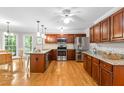 Bright kitchen featuring stainless steel appliances, granite countertops and a breakfast nook with view to outdoors at 106 Ridgepath Way, Cary, NC 27511