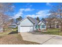 Charming one-story home with blue siding, attached garage, blue shutters and a well-kept lawn at 11113 N Radner Way, Raleigh, NC 27613