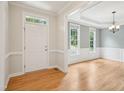 Inviting foyer with gleaming hardwood floors, fresh paint and elegant trim at 113 Bergeron Way, Cary, NC 27519