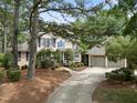 Traditional two-story home with landscaped front yard and detached two-car garage at 1300 Heritage Club Ave, Wake Forest, NC 27587