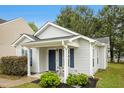 Attractive single-story home with a charming porch, perfect for enjoying the outdoors at 1506 Golden Bell Dr, Raleigh, NC 27610