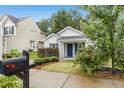 Inviting single-story home with a well-manicured lawn and quaint front porch at 1506 Golden Bell Dr, Raleigh, NC 27610