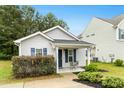 Lovely single-story home featuring a welcoming front porch and tidy landscaping at 1506 Golden Bell Dr, Raleigh, NC 27610