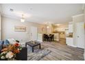 Spacious living room featuring wood floors, a comfortable seating area, and an open layout at 1912 Parkside Village Dr, Clayton, NC 27520