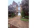 Charming brick building with manicured landscaping and a welcoming front entrance at 2221 Delaney Dr # 112, Burlington, NC 27215