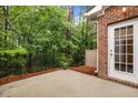 Private outdoor patio with a wooded view, perfect for relaxation at 238 Langford Valley Way, Cary, NC 27513