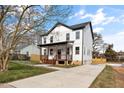 Beautiful two-story home featuring a covered front porch and a well-maintained lawn at 2517 Newbold St, Raleigh, NC 27603