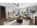 Cozy living room with neutral furniture, area rug and natural light at 2604 Fortrose Ln, Fuquay Varina, NC 27526