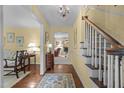 Open foyer featuring hardwood floors and decorative lighting at 3919 Wentworth Dr, Durham, NC 27707