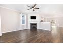 Bright living room with a fireplace, hardwood floors, and ample natural light at 57 S Shreve Dr, Wendell, NC 27591
