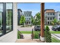 Neighborhood view from covered porch highlighting well-manicured lawns at 606 Velma Hopkins Ln, Raleigh, NC 27603