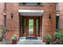 Exterior entryway showing double doors with side lites and potted greenery enhancing the entrance at 620 Martin Luther King Jr. Blvd # 302, Chapel Hill, NC 27514