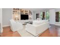Bright living room boasts custom built-ins, modern furnishings, and a walkout balcony at 620 Martin Luther King Jr. Blvd # 302, Chapel Hill, NC 27514