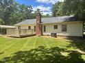 Expansive backyard with a wooden deck, perfect for outdoor entertaining at 708 Old Barn Ave, Durham, NC 27704
