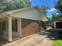 Side view of house, carport, and driveway at 708 Old Barn Ave, Durham, NC 27704
