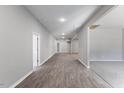 Bright hallway with new laminate flooring that extends into the living spaces at 714 Harriett St, Henderson, NC 27536