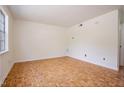 Bright bedroom with parquet floors and a large window at 1002 Willow Drive Dr # 37, Chapel Hill, NC 27514
