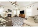 Bright and airy living room with a fireplace, neutral decor, and an elegant area rug at 102 Michelangelo Pl, Morrisville, NC 27560