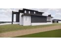 Side view of modern home highlighting unique architectural details at 1021 Ferson, Apex, NC 27519