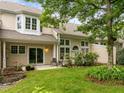 Picturesque backyard oasis with a green lawn, a patio, and lush greenery at 103 Lake Tillery Dr, Cary, NC 27519