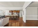 Open kitchen with a large island, hardwood floors, stainless steel appliances, and modern finishes at 10529 Sablewood Dr # 111, Raleigh, NC 27617