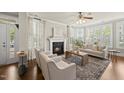 Bright living room with fireplace, plantation shutters and natural light at 10529 Sablewood Dr # 111, Raleigh, NC 27617